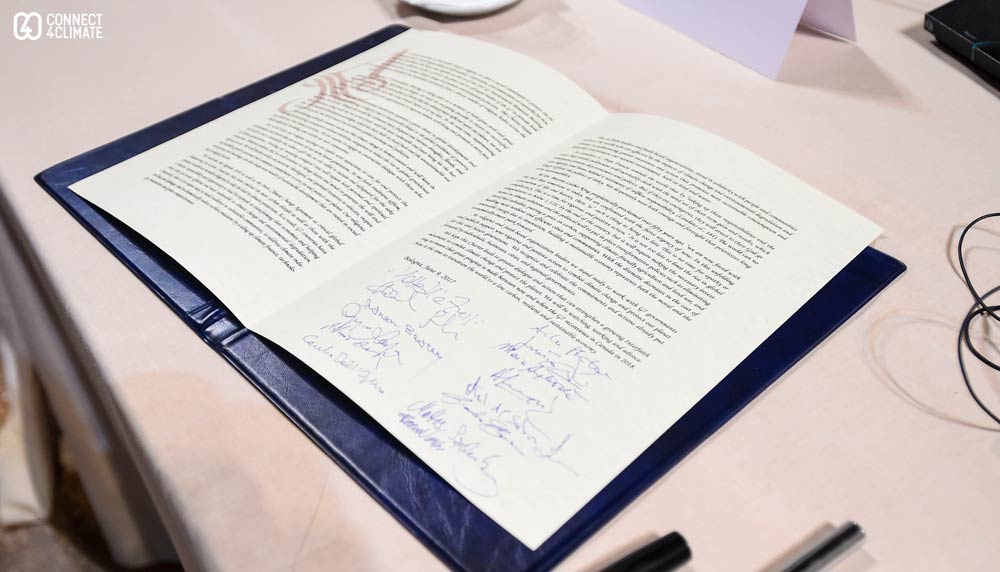 The “Bologna Interfaith Charter: Living Our Values, Acting for Our Common Home” signed by the religious representatives. Photo Credits: Riccardo Savi/Connect4Climate