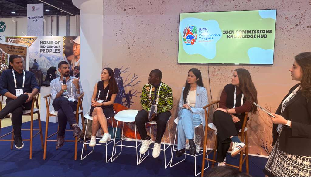 Six young people on chairs have a discussion at the IUCN Commissions Knowledge Hub.